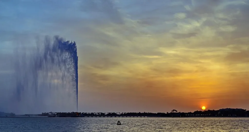 A fountain rising above the sea off Jeddah at sunset